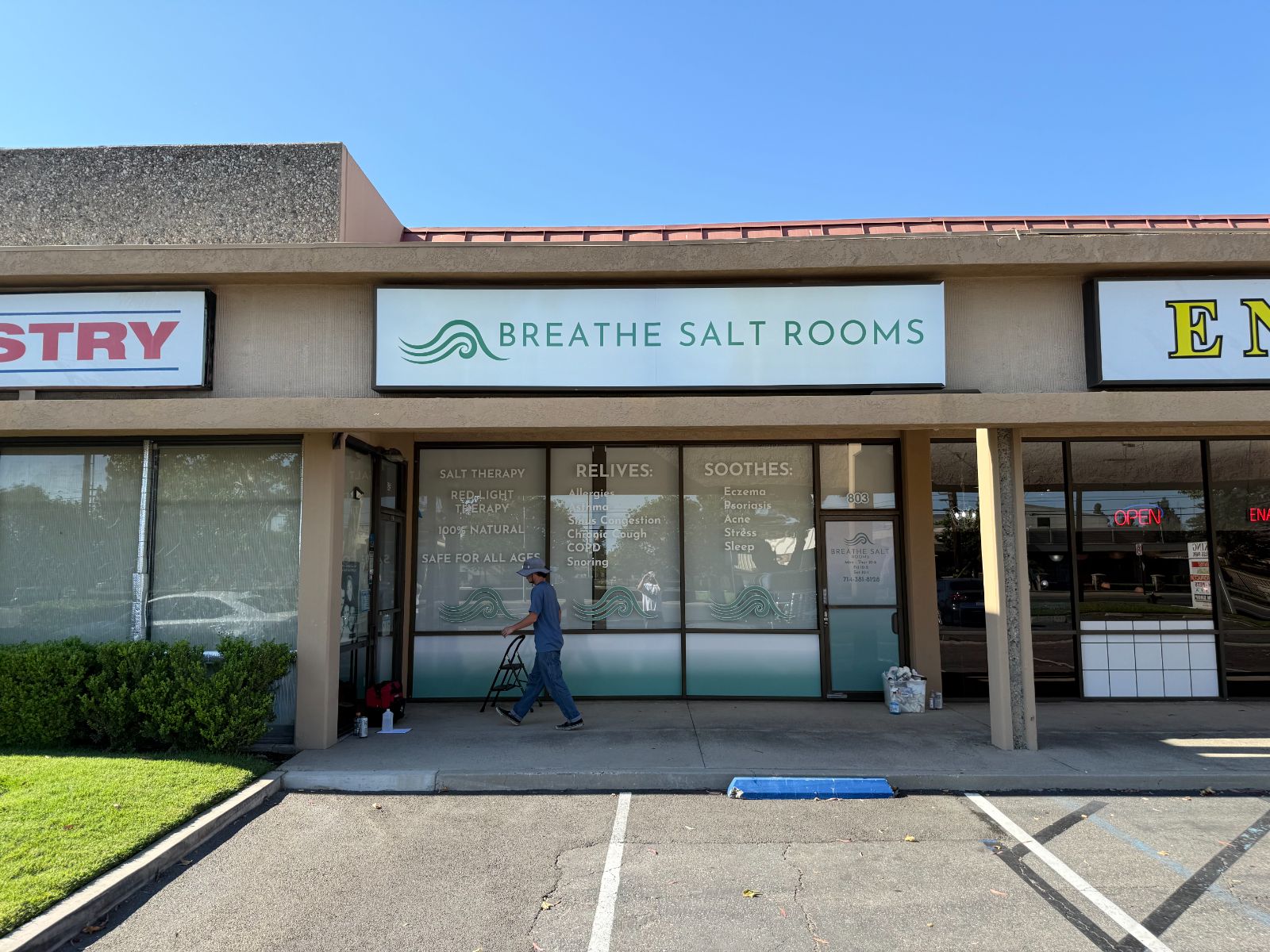 Breathe Salt Rooms storefront with a fascia sign and windows filled with cut and printed vinyl